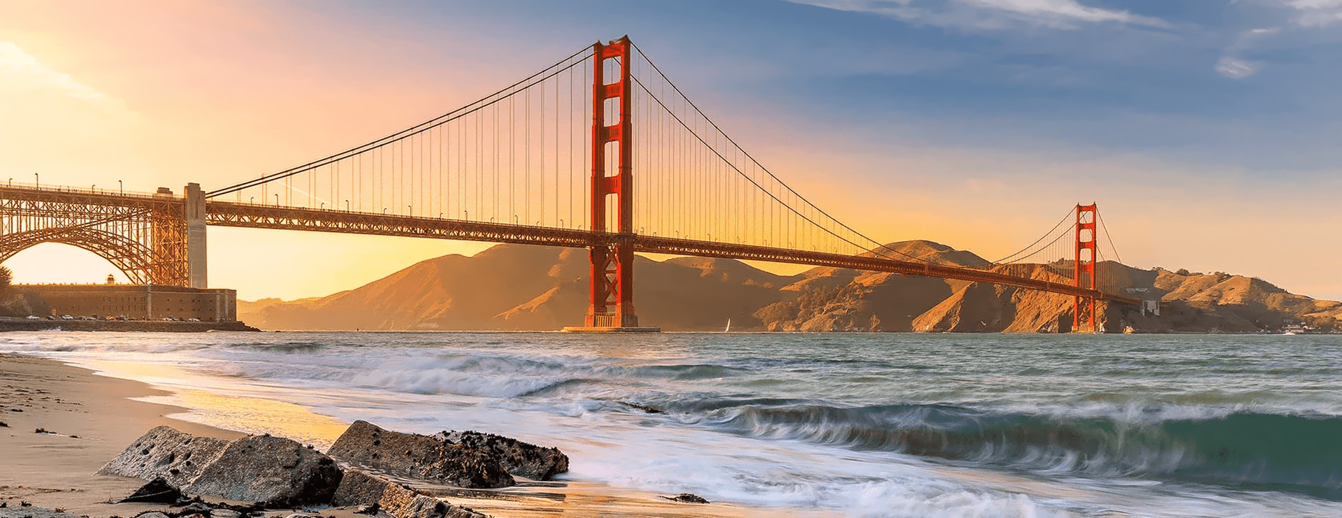 Views of San Francisco: the Golden Gate Bridge at sunset, downtown and the Transamerica Pyramid from the air, and the Bay Bridge lit up at night
