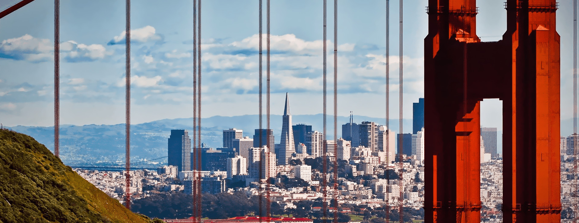 Views of San Francisco: downtown framed by the Golden Gate Bridge, the ballpark and South Beach from the air, and the Palace of Fine Arts at twilight